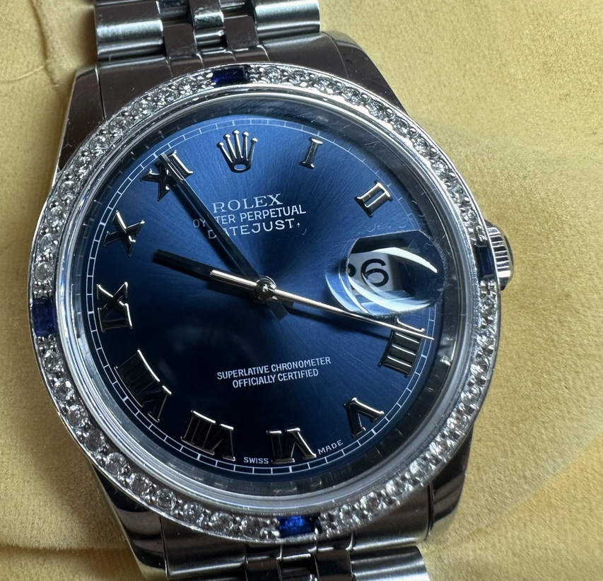 Close view of the Datejust blue sunburst dial and Roman numeral markers